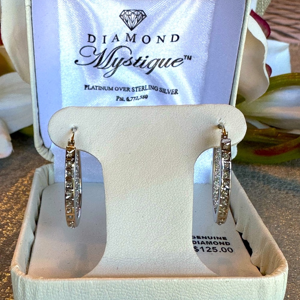 Diamond Mystique platinum over sterling silver CZ earrings.